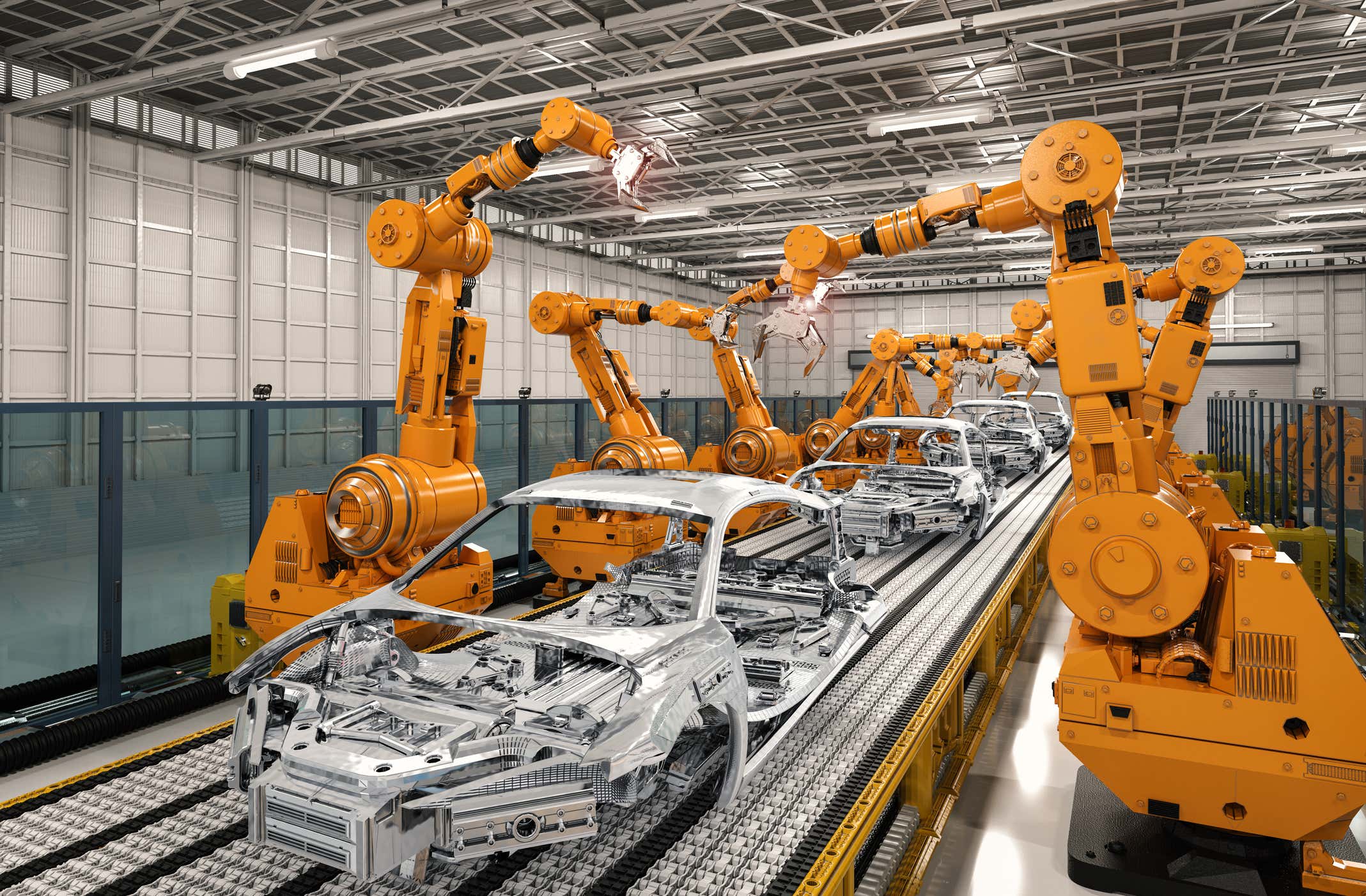 A factory line of cars under construction. 正在建设的汽车生产线。