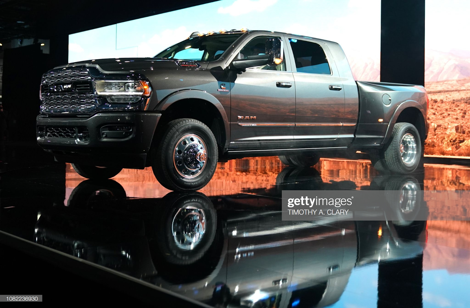 A Ram truck sitting on a stage. 一辆公羊卡车停在舞台上。